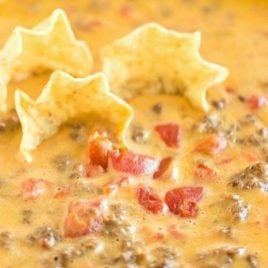chips dipping into rotel dip